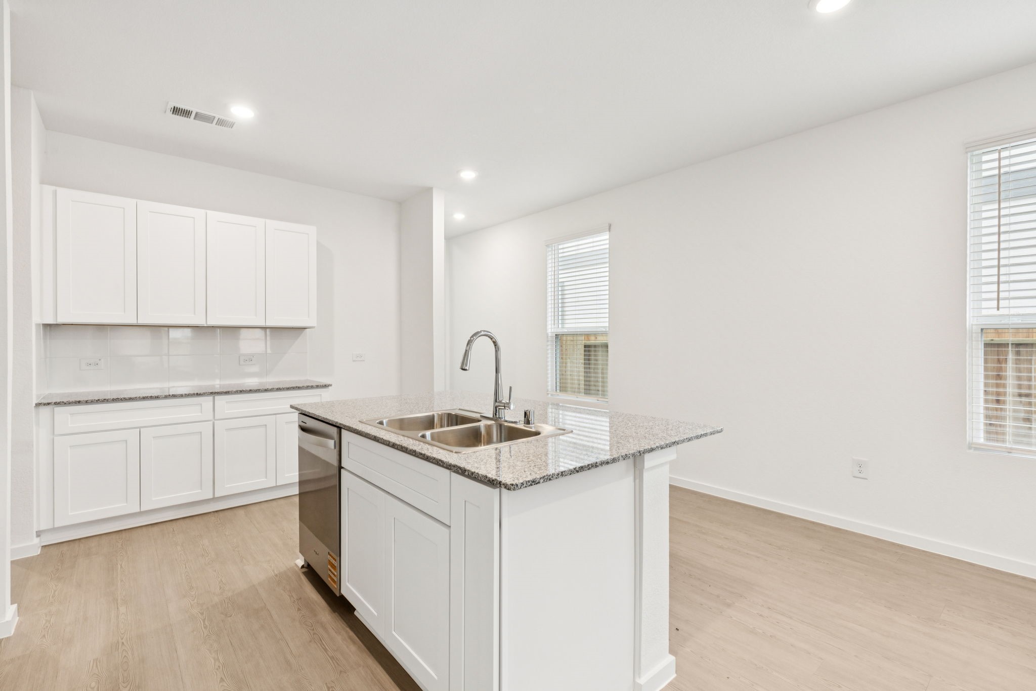 26279 Arrowleaf Drive Magnolia, TX 77355 - Photo 5 of 35 a kitchen that has a sink and a stove in it