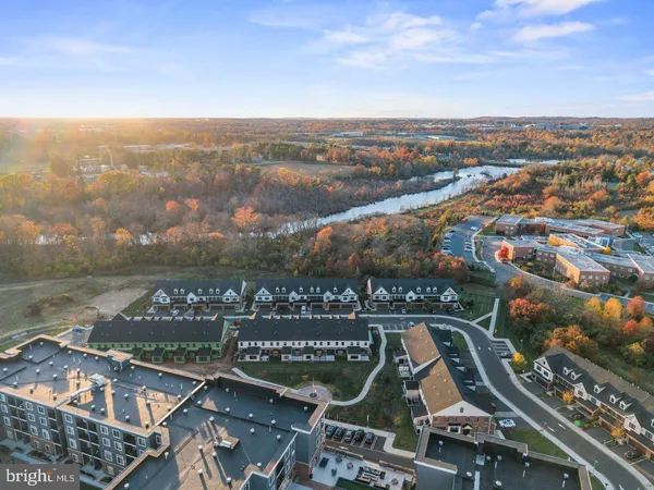 an aerial view of residential building and ocean view