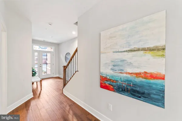 a view of an entryway with wooden floor