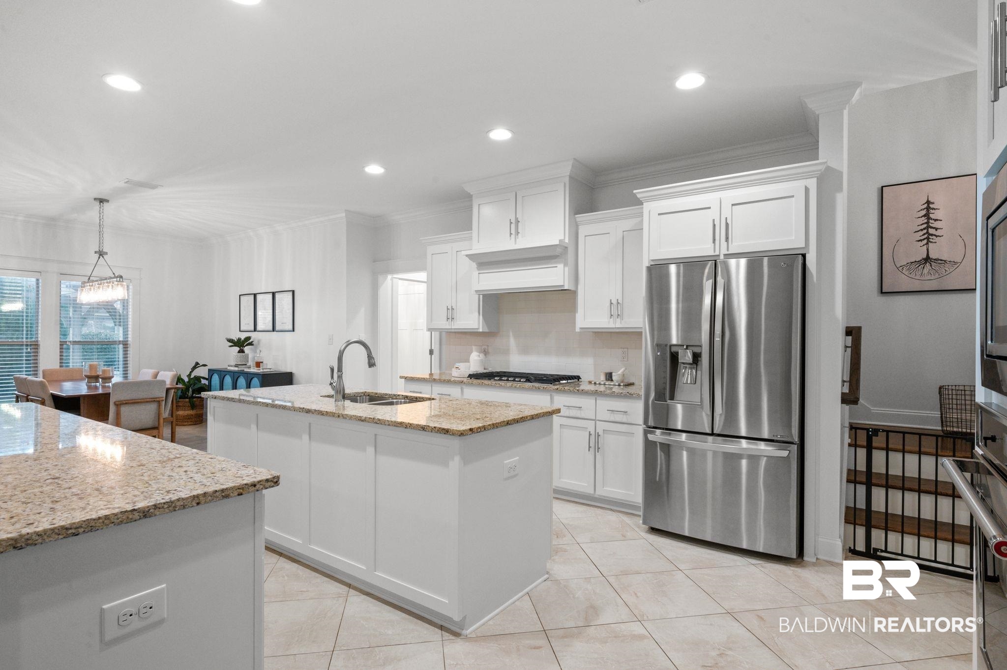 418 Fortune Drive Fairhope, AL 36532 - Photo 12 of 63 Kitchen with sink, hanging light fixtures, stainless steel appliances, and white cabinets