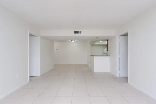 a kitchen with granite countertop cabinets stainless steel appliances and a sink