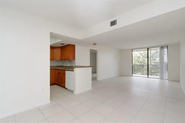 a view of a kitchen with a sink and cabinets