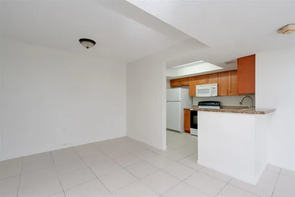 a view of a kitchen with a sink