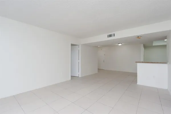 a view of kitchen with white cabinets
