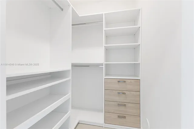 a view of an empty walk in closet