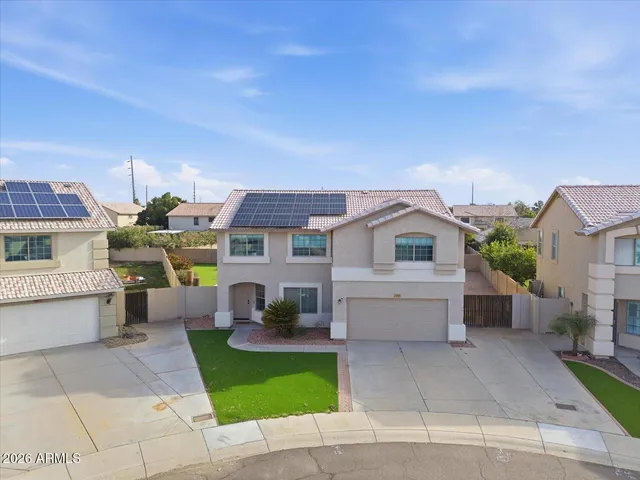 an aerial view of a city with a mountain