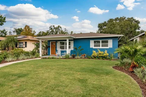 a front view of house with yard and green space