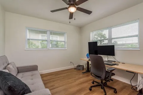 a workspace with furniture and a window