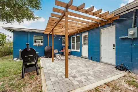 a backyard of a house with seating space