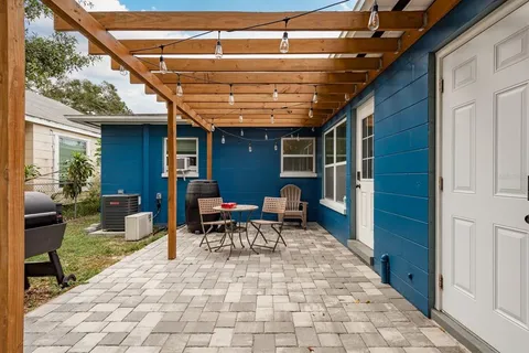 a backyard of a house with seating space