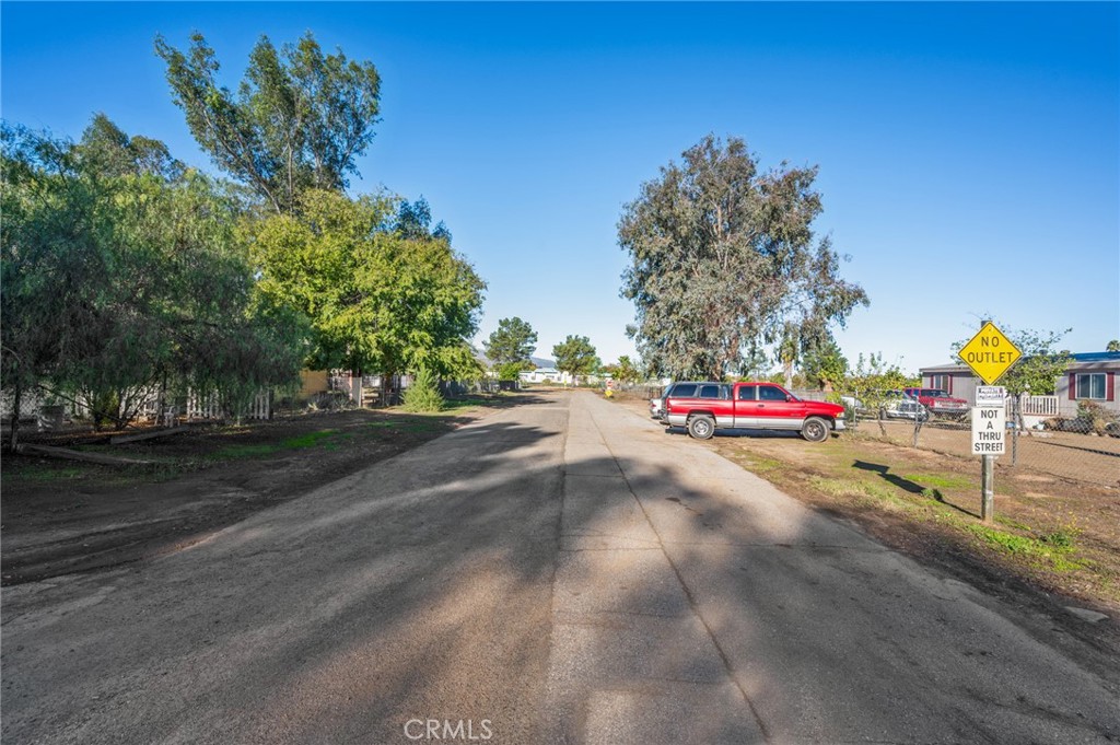 20220 Union Street Wildomar, CA 92595 - Photo 11 of 13 a view of road with trees