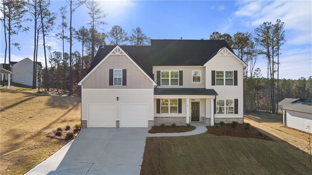 687 Ralph Still Road Dacula, GA 30019 - Photo 1 of 1 a view of a big house with a big yard and large trees