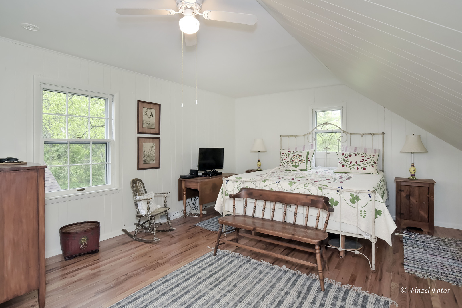 9313 Bull Valley Road Bull Valley, IL 60098 - Photo 16 of 31 a bedroom with a bed and wooden floor