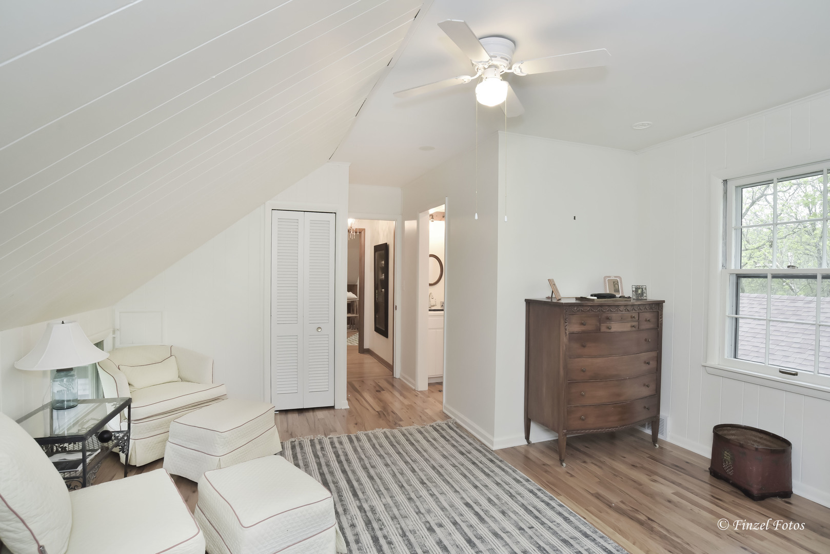 9313 Bull Valley Road Bull Valley, IL 60098 - Photo 17 of 31 a living room with furniture and a chandelier