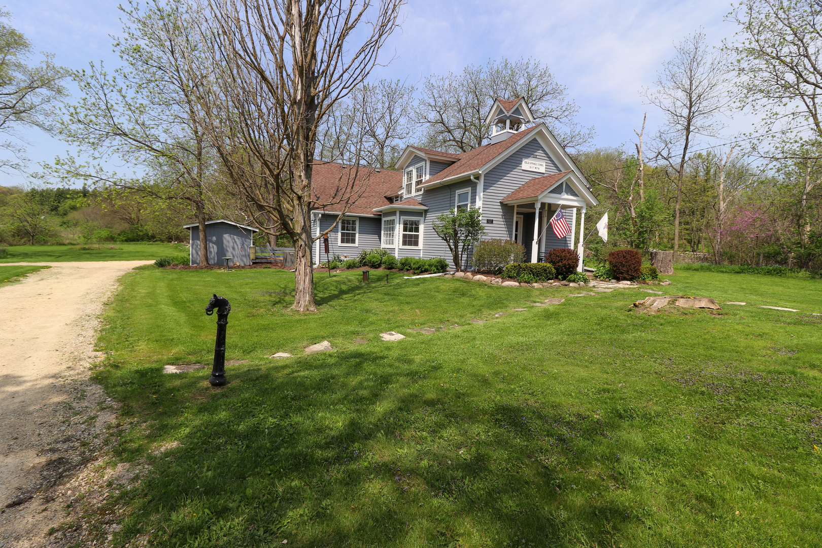 9313 Bull Valley Road Bull Valley, IL 60098 - Photo 3 of 31 a house view with garden space and trees
