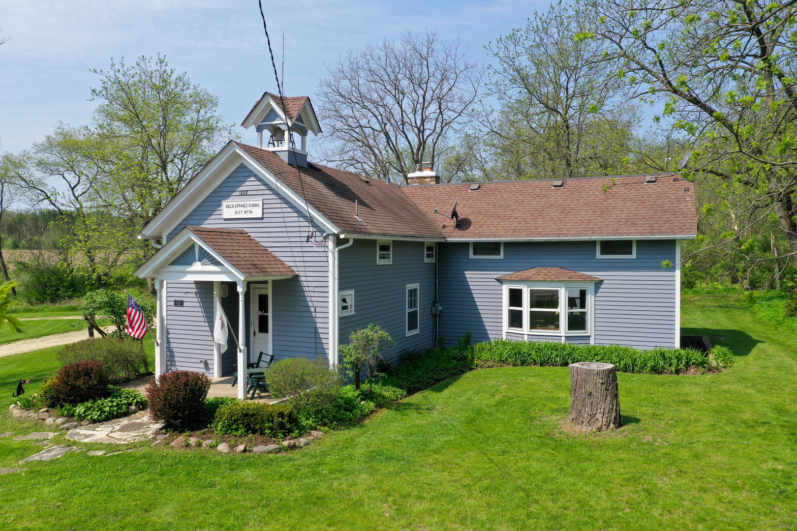 9313 Bull Valley Road Bull Valley, IL 60098 - Photo 4 of 31 a front view of a house with a yard and tree