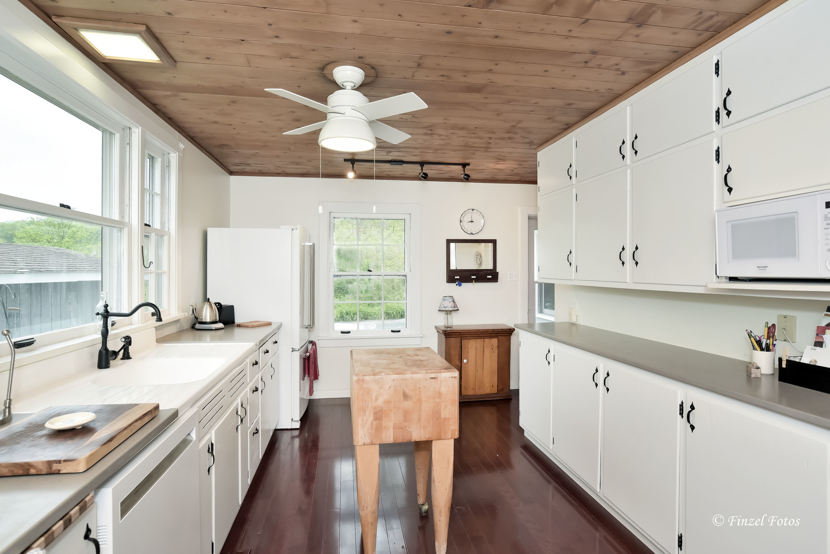 9313 Bull Valley Road Bull Valley, IL 60098 - Photo 10 of 31 a large white kitchen with a large window