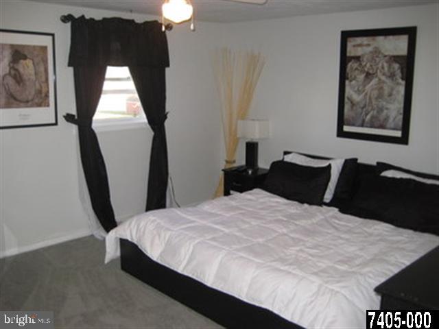 2213 Chestnut Road York, PA 17408 - Photo 12 of 25 a bedroom with a bed and a painting on the wall