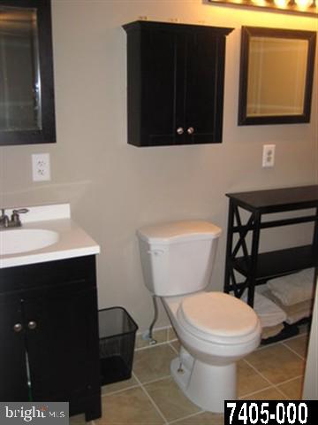 2213 Chestnut Road York, PA 17408 - Photo 13 of 25 a bathroom with a toilet a sink and mirror