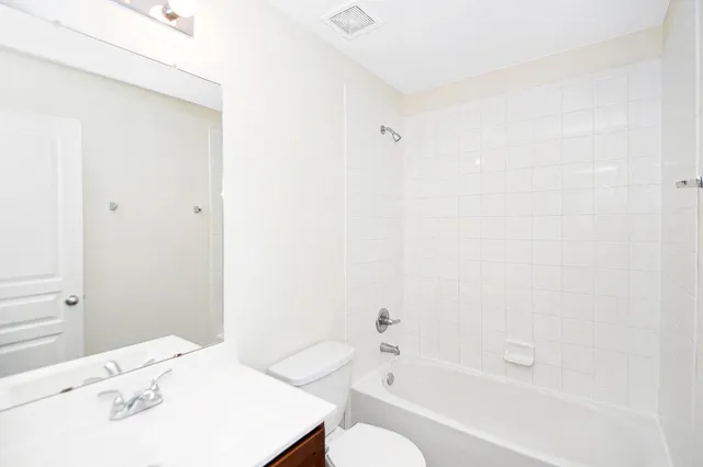 a bathroom with a bathtub and a sink