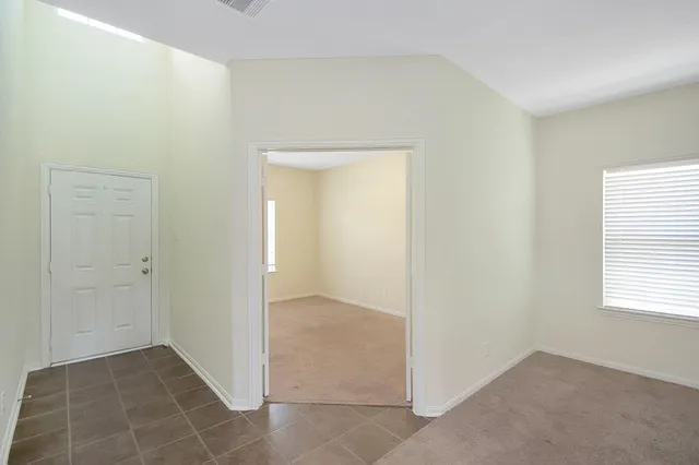 a view of an empty room and window