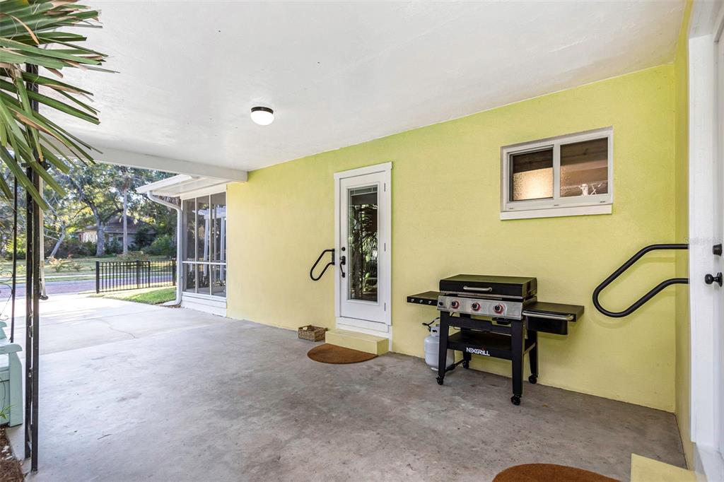 116 Read Street Tarpon Springs, FL 34689 - Photo 16 of 49 a view of a livingroom with furniture and a piano