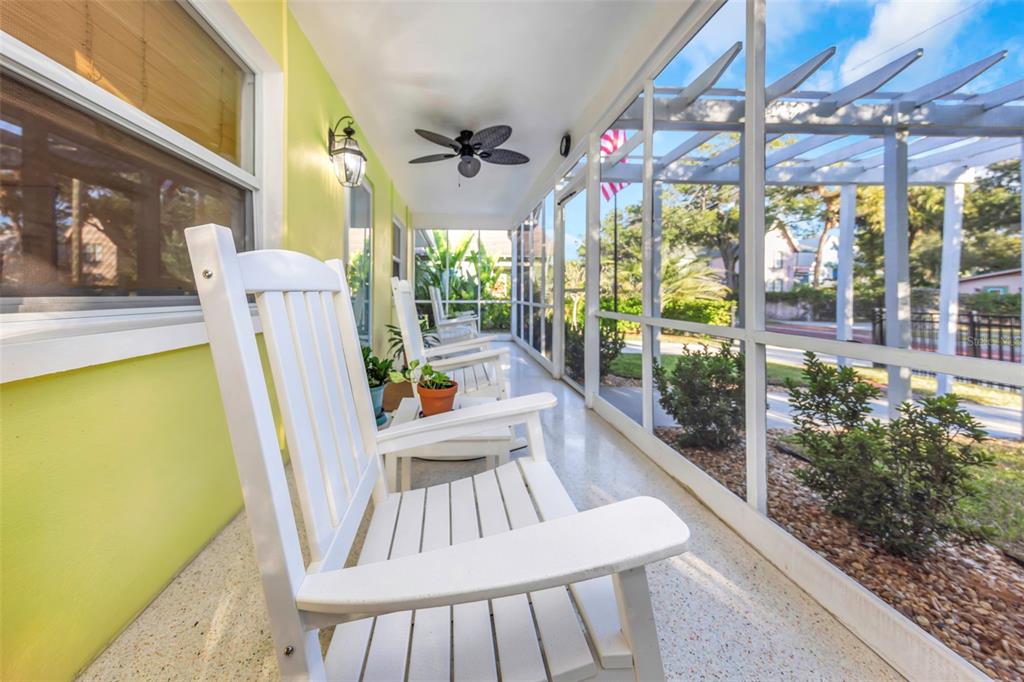 116 Read Street Tarpon Springs, FL 34689 - Photo 20 of 49 a view of a dining room with furniture a chandelier and wooden floor