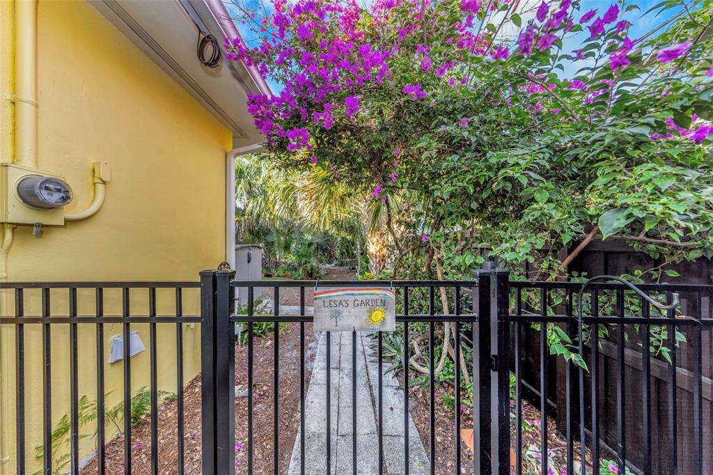116 Read Street Tarpon Springs, FL 34689 - Photo 22 of 49 a view of a house with a flower garden