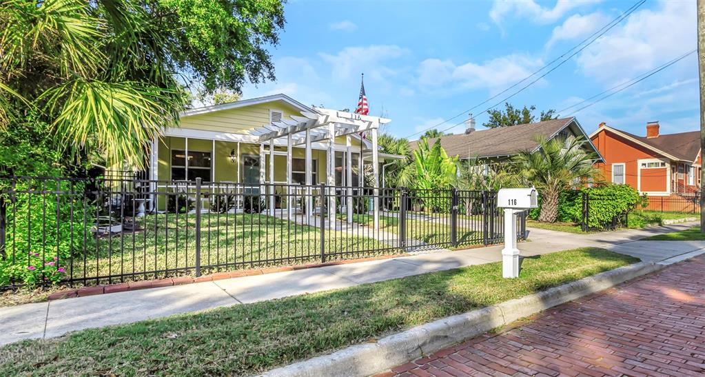 116 Read Street Tarpon Springs, FL 34689 - Photo 3 of 49 a view of a house with a yard and plants