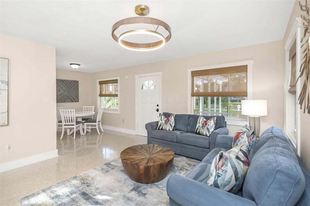 116 Read Street Tarpon Springs, FL 34689 - Photo 32 of 49 a living room with furniture and a wooden floor