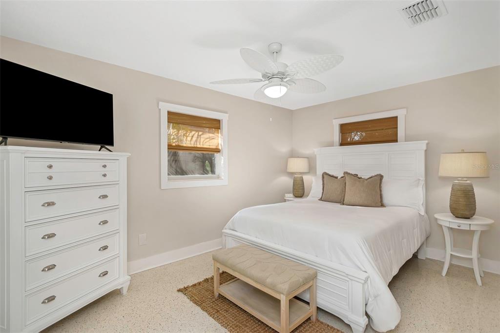 116 Read Street Tarpon Springs, FL 34689 - Photo 39 of 49 a bedroom with a bed and a flat screen tv
