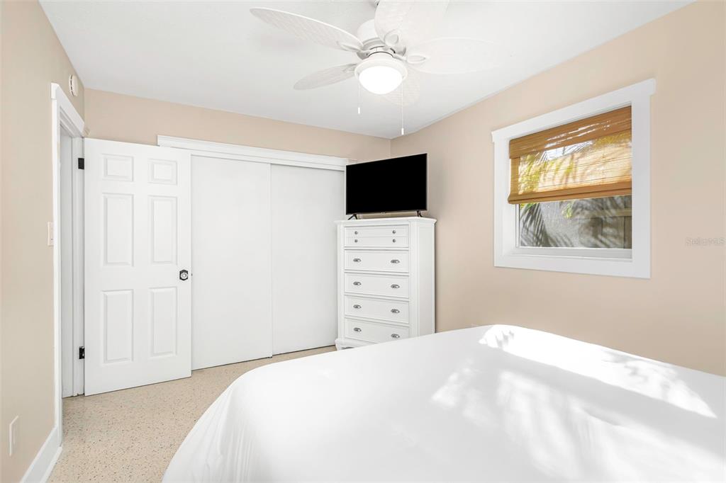 116 Read Street Tarpon Springs, FL 34689 - Photo 41 of 49 a bedroom with a bed and a flat screen tv