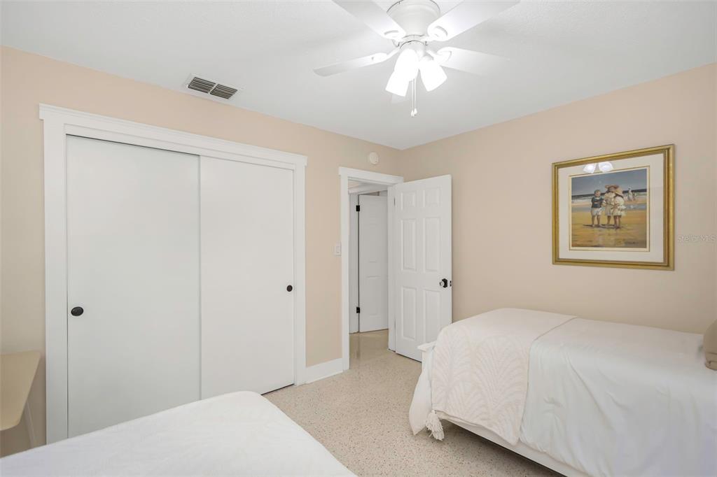 116 Read Street Tarpon Springs, FL 34689 - Photo 43 of 49 a bedroom with a bed and a chandelier