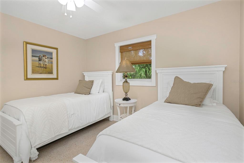 116 Read Street Tarpon Springs, FL 34689 - Photo 44 of 49 a bedroom with two beds and a painting on the wall