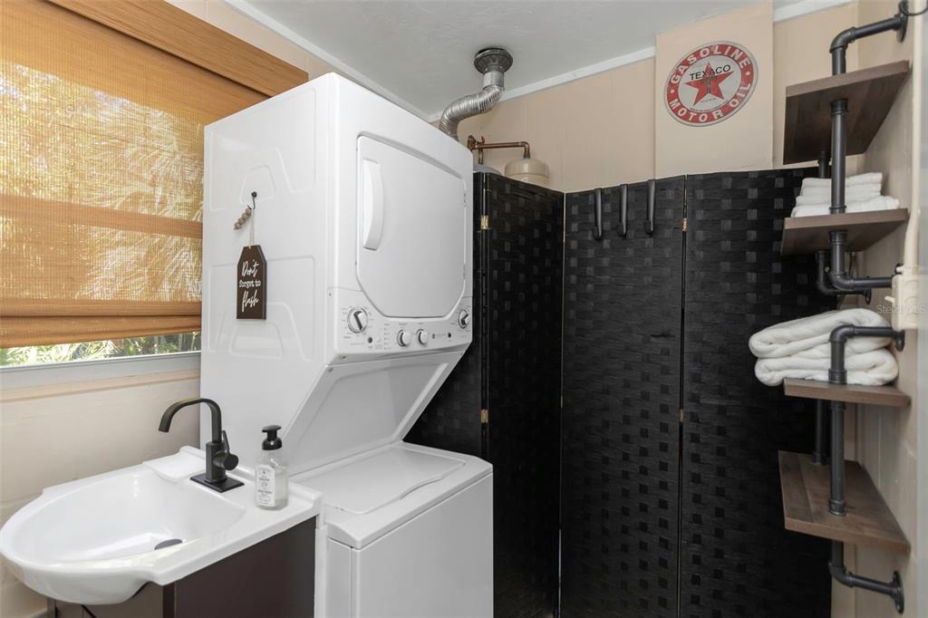 116 Read Street Tarpon Springs, FL 34689 - Photo 45 of 49 a bathroom with a sink toilet and a mirror