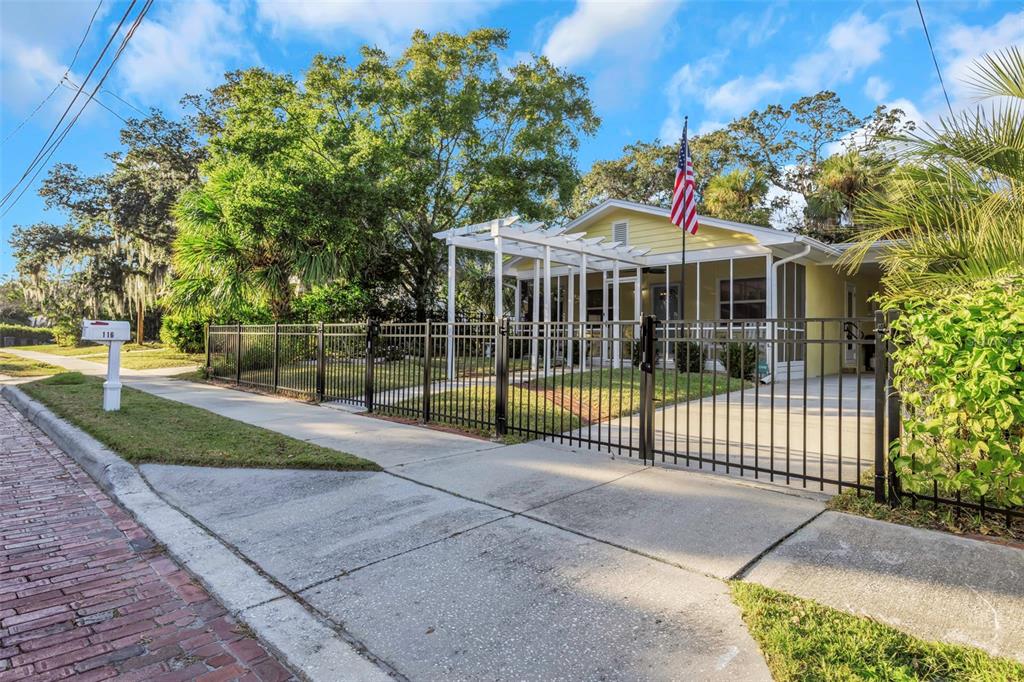 116 Read Street Tarpon Springs, FL 34689 - Photo 7 of 49 a view of a house with a backyard and a garden
