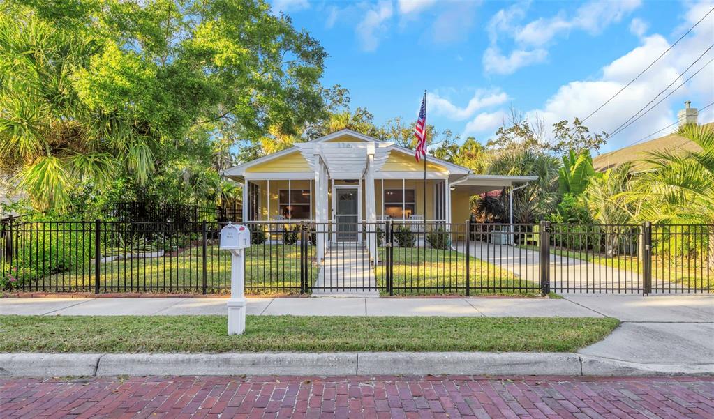 116 Read Street Tarpon Springs, FL 34689 - Photo 8 of 49 a view of a house with a backyard and a patio