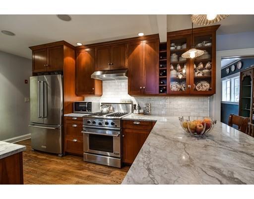 44 Bay State Road Wellesley, MA 02481 - Photo 8 of 15 a kitchen with stainless steel appliances granite countertop a refrigerator and a stove
