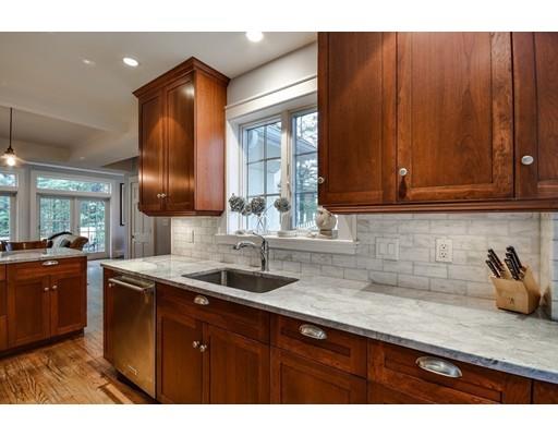 44 Bay State Road Wellesley, MA 02481 - Photo 9 of 15 a kitchen with stainless steel appliances granite countertop wooden cabinets a sink and dishwasher