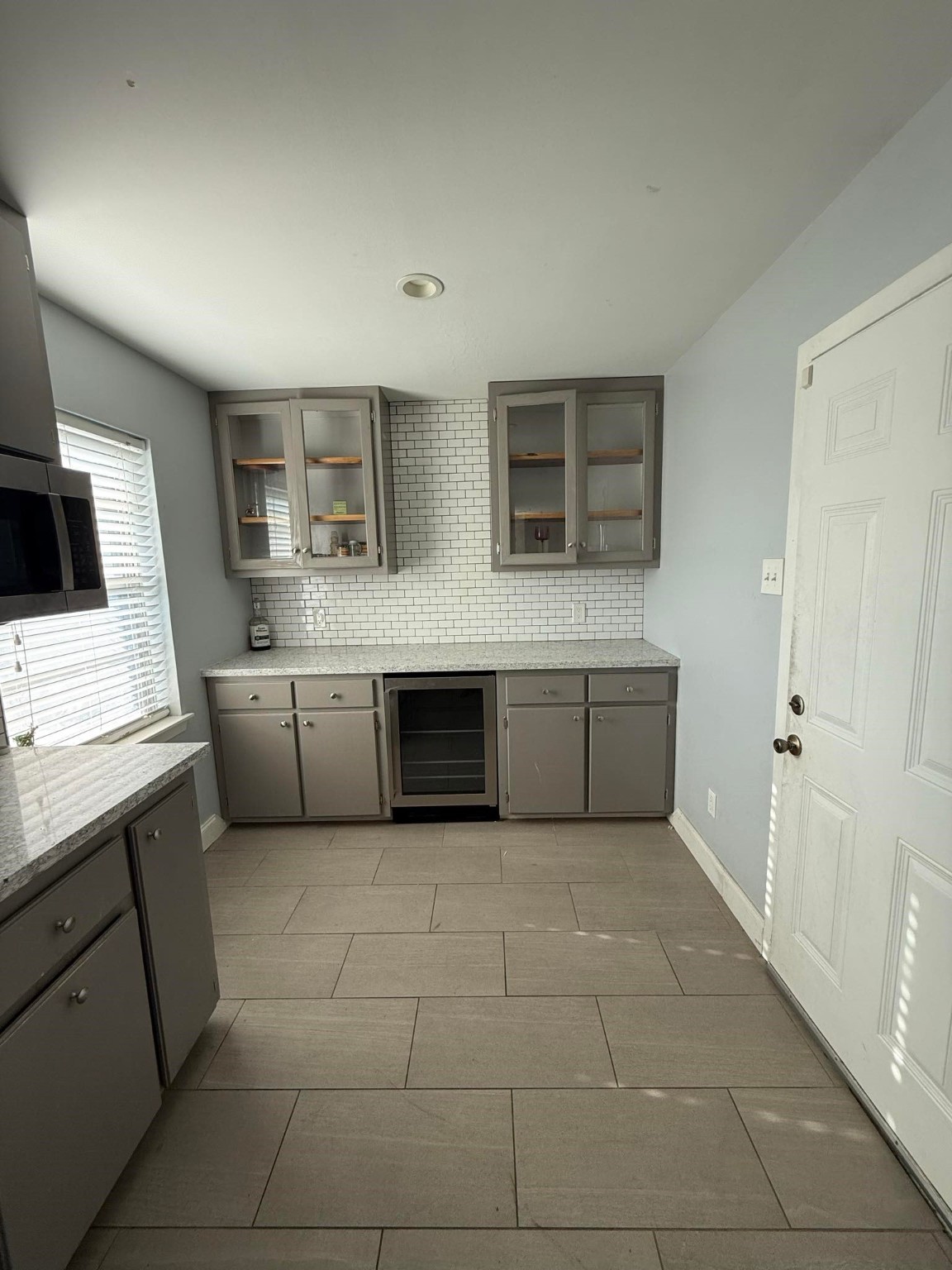 11210 Sageoak Drive Houston, TX 77089 - Photo 12 of 18 a kitchen with a cabinets and white appliances