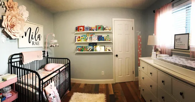 a view of a hallway with furniture and wooden floor