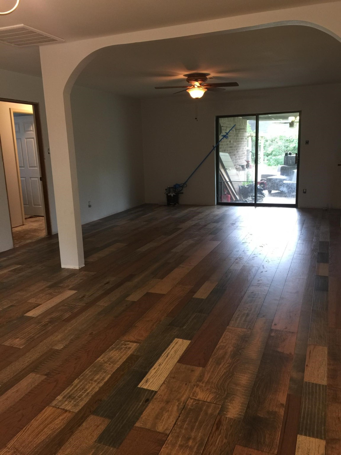 11210 Sageoak Drive Houston, TX 77089 - Photo 5 of 18 a view of empty room with wooden floor and fan