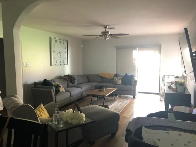 a living room with furniture and a window