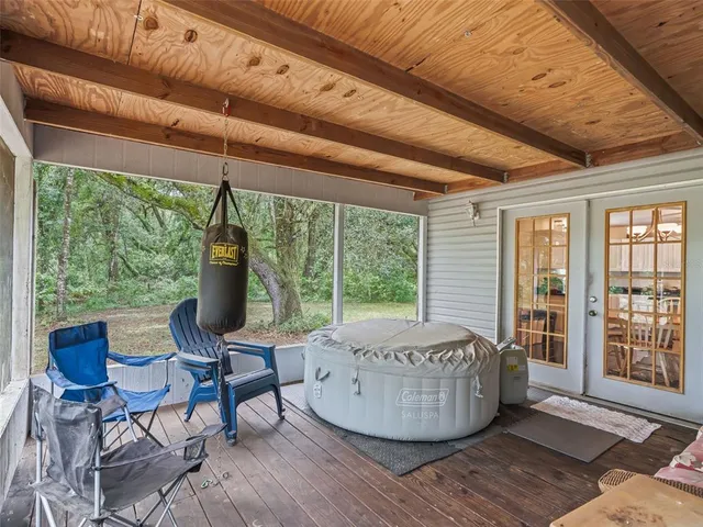 a room with furniture and a floor to ceiling window