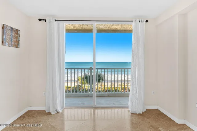 a view of a glass door with a close up of a shower
