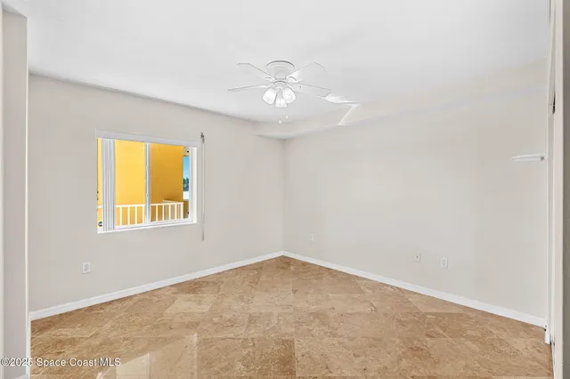 a bathroom with a granite countertop sink toilet mirror and bathtub