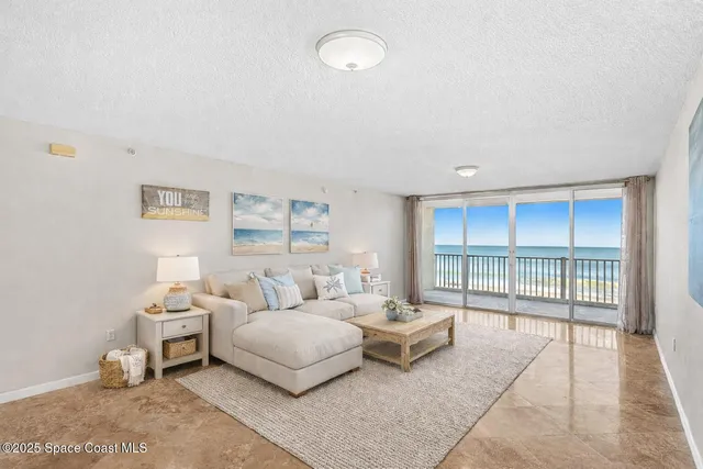 a bedroom with a bed and glass window