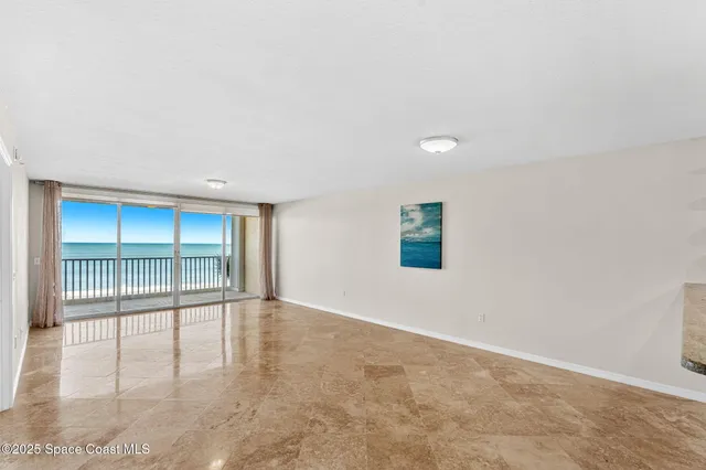 a view of a bedroom with wooden floor
