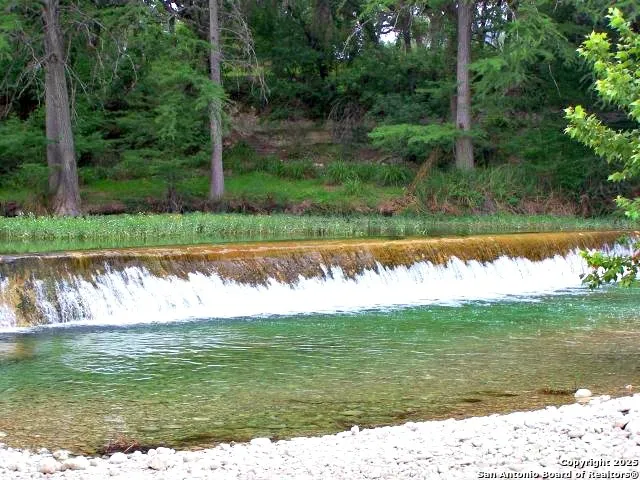 a view of a lake from a yard