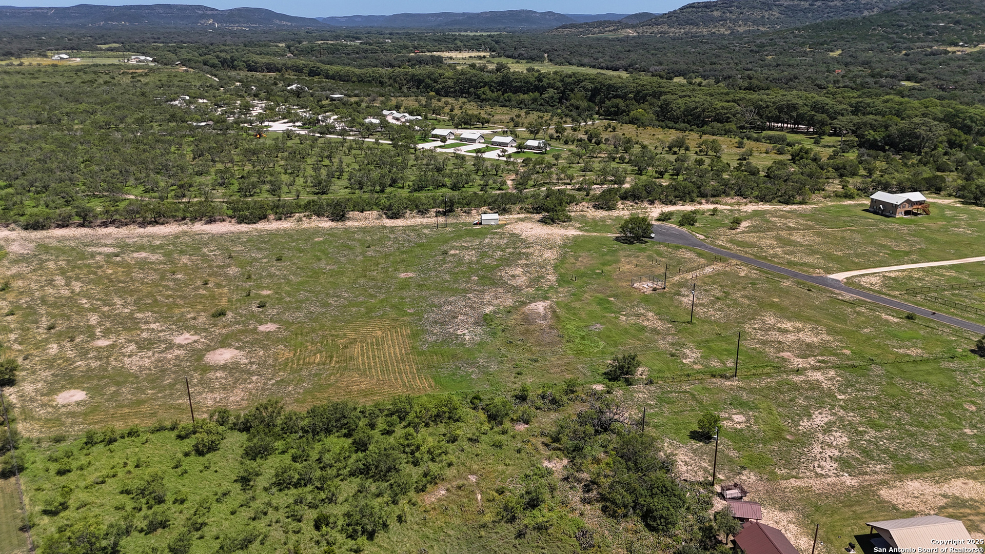 319 RiverTree N Road Rio Frio, TX 78879 - Photo 2 of 21 a view of a town with mountains in the background